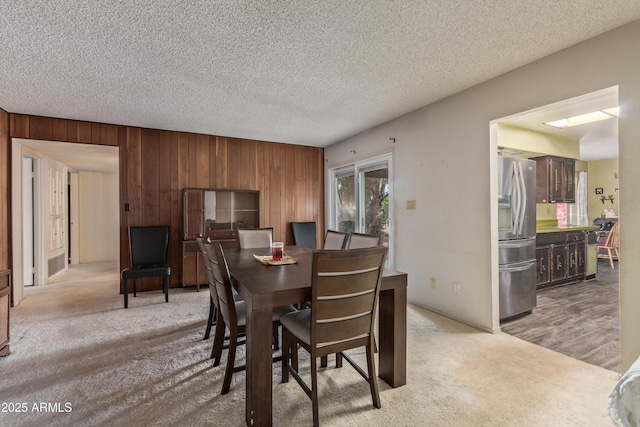 8540 N 43rd Dr, Glendale, AZ 85302 - dining room featuring wooden walls, carpet, and a textured ceiling