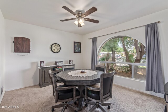 8540 N 43rd Dr, Glendale, AZ 85302 - dining area featuring light colored carpet, ceiling fan, and baseboards