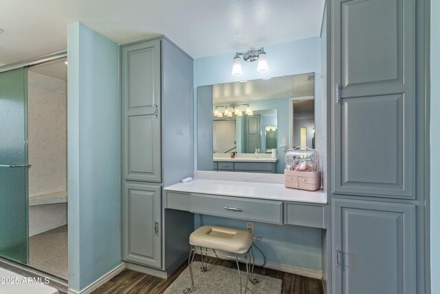 8540 N 43rd Dr, Glendale, AZ 85302 - bathroom with wood finished floors, a stall shower, and vanity