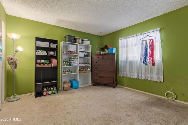 8540 N 43rd Dr, Glendale, AZ 85302 - rec room featuring carpet floors, a textured ceiling, and baseboards