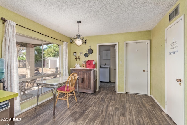 8540 N 43rd Dr, Glendale, AZ 85302 - dining space with a textured ceiling, washer / clothes dryer, dark wood-style flooring, and baseboards