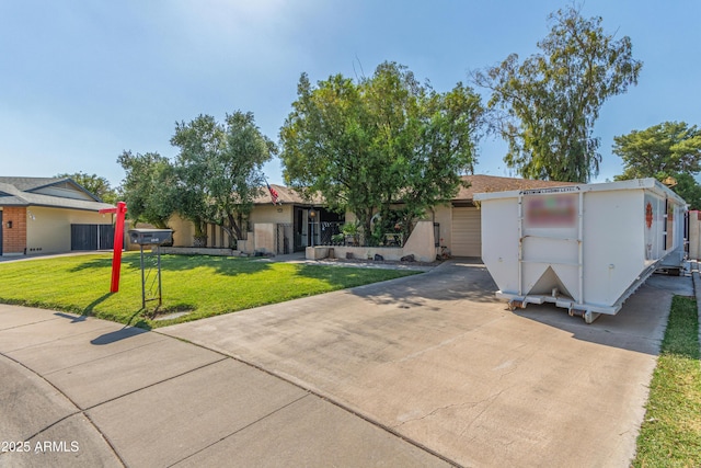 8540 N 43rd Dr, Glendale, AZ 85302 - view of front of property with a front lawn and concrete driveway