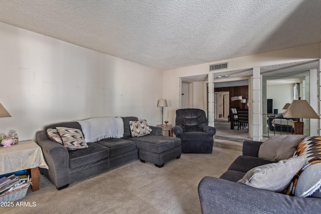 8540 N 43rd Dr, Glendale, AZ 85302 - living room featuring carpet flooring and a textured ceiling