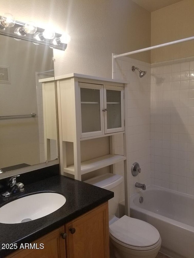 full bathroom featuring vanity, shower / bathing tub combination, toilet, and visible vents