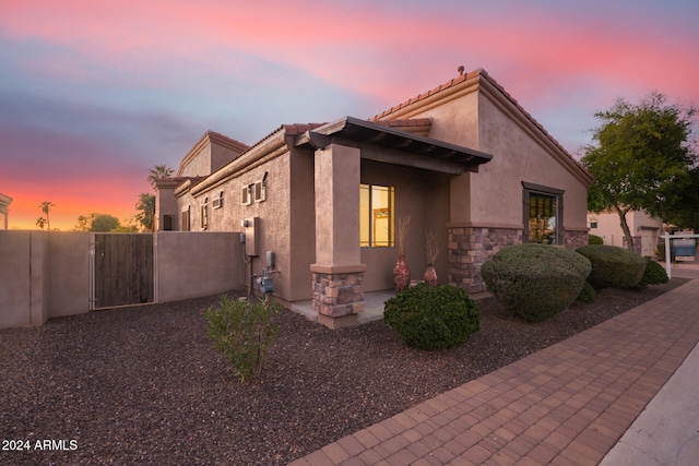 view of property exterior at dusk