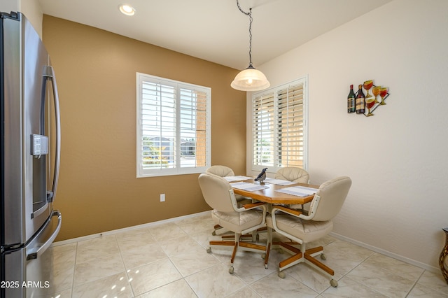 dining space with light tile patterned floors