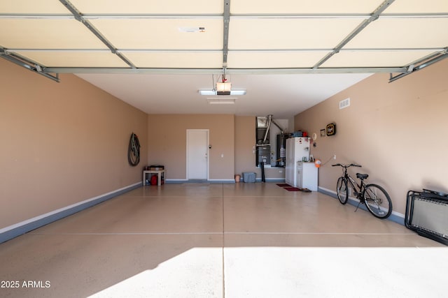 garage featuring white fridge