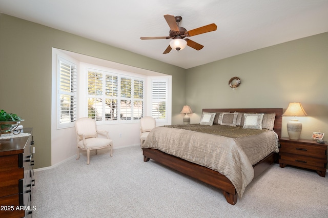 bedroom featuring ceiling fan and light colored carpet