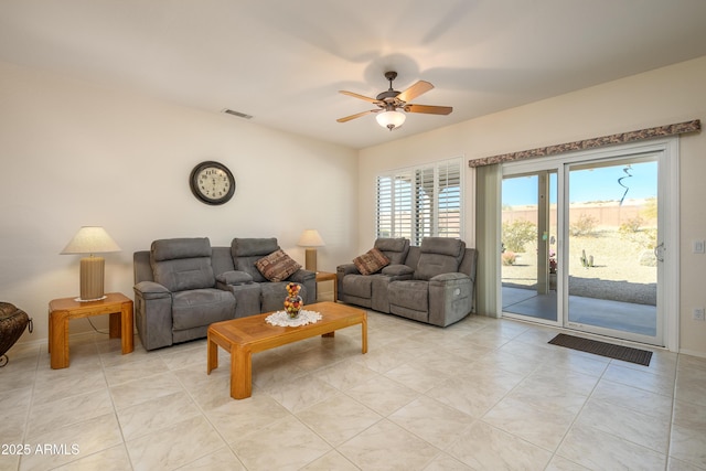 tiled living room featuring ceiling fan