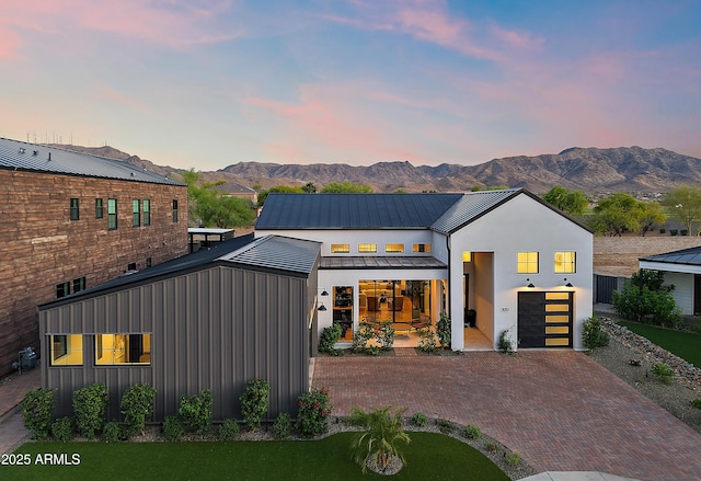 1013 W Ardmore Rd, Phoenix, AZ 85041 - modern farmhouse style home featuring decorative driveway, a mountain view, a standing seam roof, and metal roof