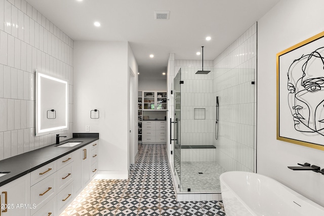 1013 W Ardmore Rd, Phoenix, AZ 85041 - full bath featuring a stall shower, a soaking tub, recessed lighting, double vanity, and tile patterned floors