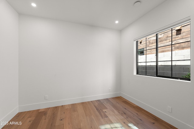 1013 W Ardmore Rd, Phoenix, AZ 85041 - unfurnished room with light wood-style floors, baseboards, and recessed lighting