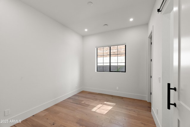 1013 W Ardmore Rd, Phoenix, AZ 85041 - empty room with light wood-style floors, baseboards, and recessed lighting