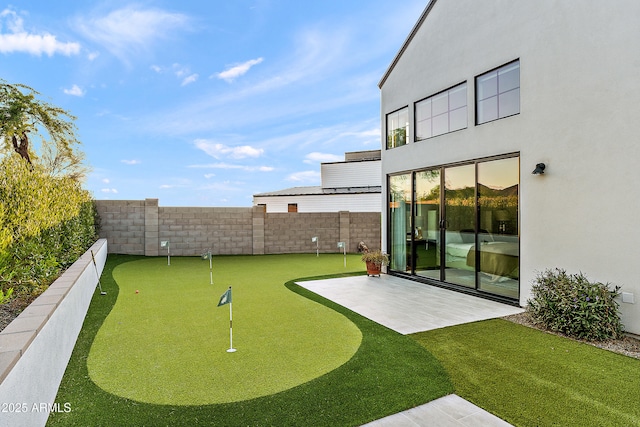 1013 W Ardmore Rd, Phoenix, AZ 85041 - fenced backyard featuring a putting area and a patio area