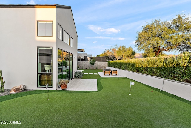 1013 W Ardmore Rd, Phoenix, AZ 85041 - view of yard with a putting green, a patio, and fence