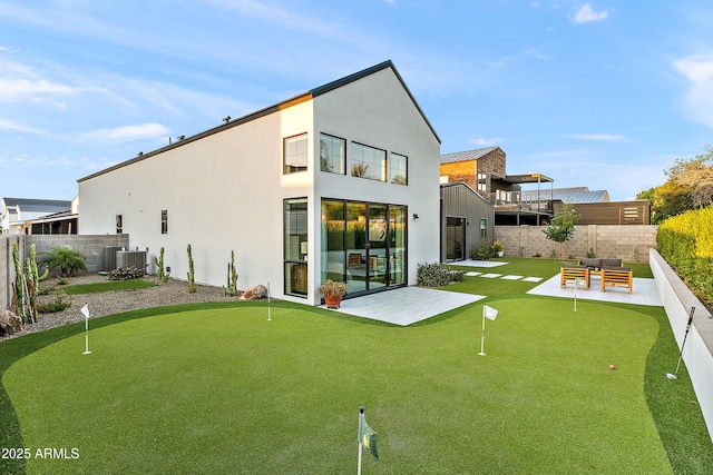 1013 W Ardmore Rd, Phoenix, AZ 85041 - rear view of house featuring a putting area, a patio, fence, and stucco siding