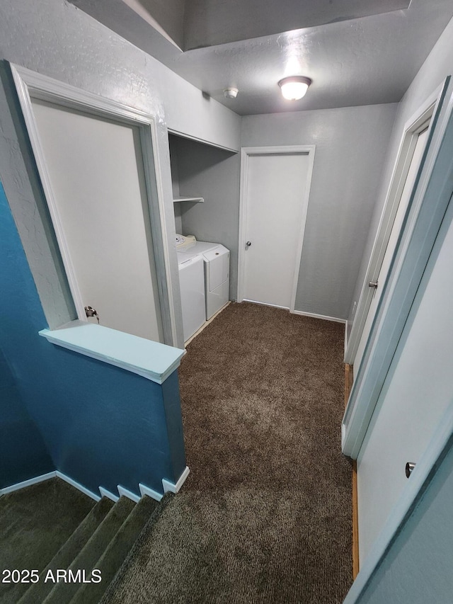 washroom with laundry area, washer and clothes dryer, baseboards, and carpet flooring