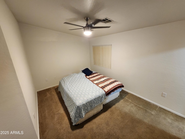 bedroom with baseboards, visible vents, and dark colored carpet