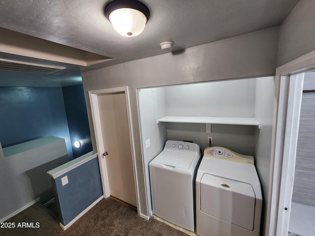 washroom featuring laundry area, washer and clothes dryer, baseboards, and dark carpet