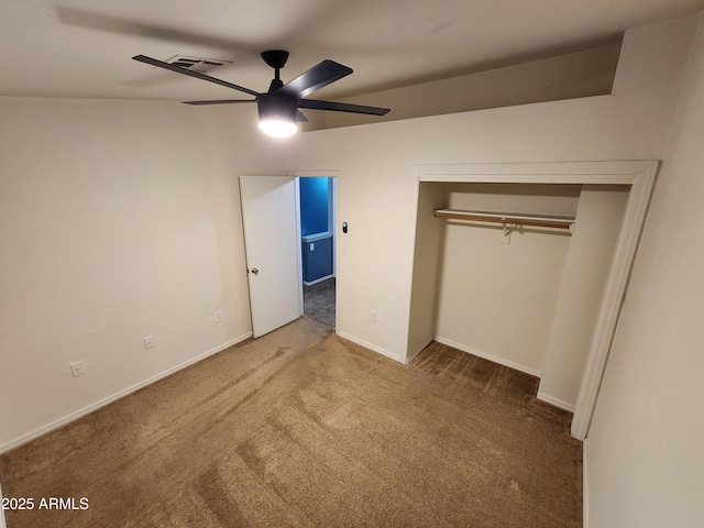 unfurnished bedroom featuring a ceiling fan, visible vents, carpet floors, baseboards, and a closet