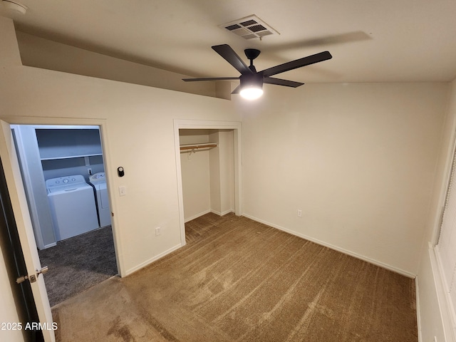unfurnished bedroom with ceiling fan, visible vents, a closet, separate washer and dryer, and carpet flooring