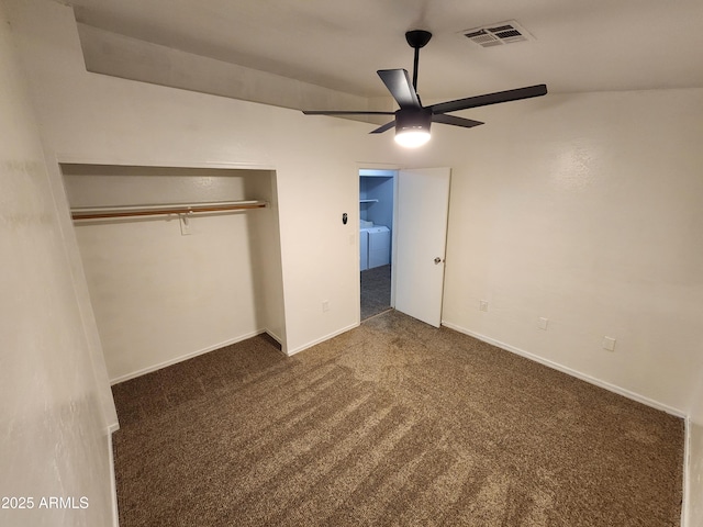 unfurnished bedroom featuring separate washer and dryer, carpet, a ceiling fan, visible vents, and a closet