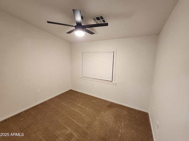 spare room featuring baseboards, a ceiling fan, carpet flooring, and visible vents