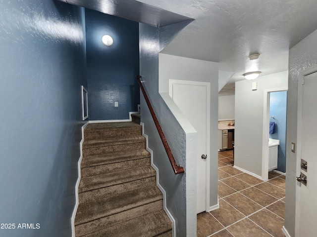 stairs featuring tile patterned floors