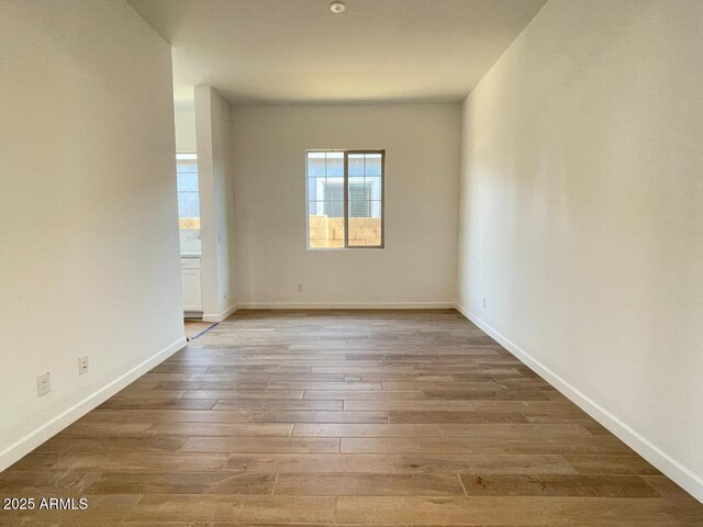 spare room featuring hardwood / wood-style floors