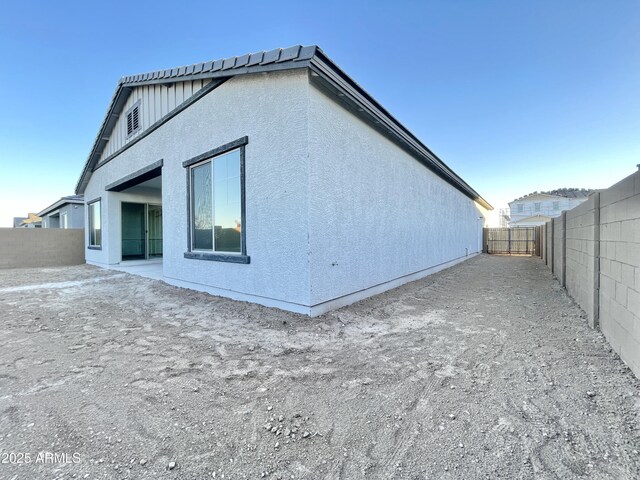 view of side of property featuring a patio