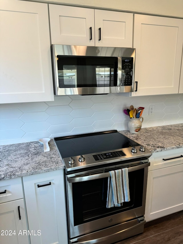 kitchen featuring appliances with stainless steel finishes and white cabinetry