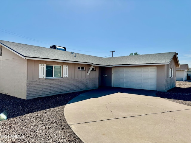 single story home featuring a garage