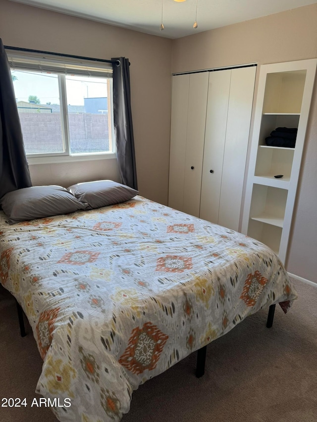 carpeted bedroom with a closet