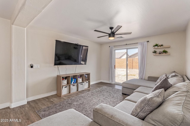 22534 W Pima St, Buckeye, AZ 85326 - living area featuring ceiling fan, wood finished floors, and baseboards