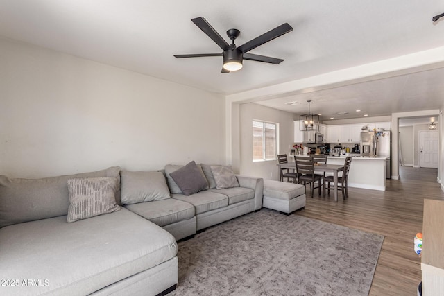 22534 W Pima St, Buckeye, AZ 85326 - living area with a ceiling fan, wood finished floors, and a chandelier