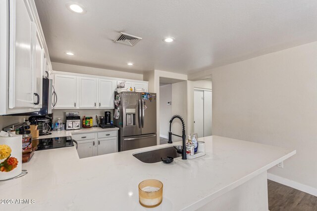 22534 W Pima St, Buckeye, AZ 85326 - kitchen featuring appliances with stainless steel finishes, a sink, light countertops, recessed lighting, and white cabinetry