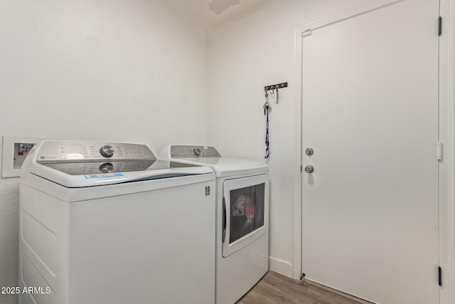 22534 W Pima St, Buckeye, AZ 85326 - laundry room featuring washing machine and dryer and light wood-type flooring