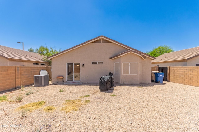 22534 W Pima St, Buckeye, AZ 85326 - rear view of property with a fenced backyard, cooling unit, and stucco siding