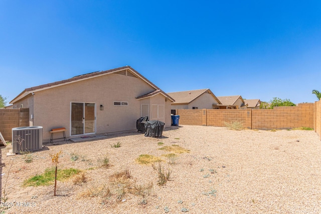 22534 W Pima St, Buckeye, AZ 85326 - rear view of house with central air condition unit, a fenced backyard, and stucco siding