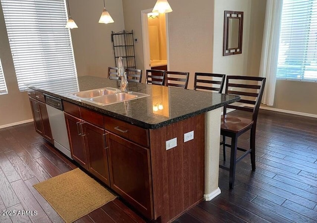 6605 N 93rd Ave Unit 1071, Glendale, AZ 85305 - kitchen featuring dishwasher, a kitchen bar, dark wood finished floors, baseboards, and a kitchen island with sink