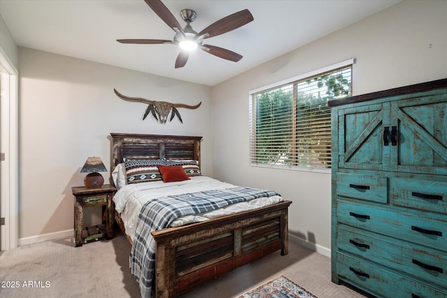 5707 N 12th Pl, Phoenix, AZ 85014 - bedroom featuring light carpet, baseboards, and a ceiling fan