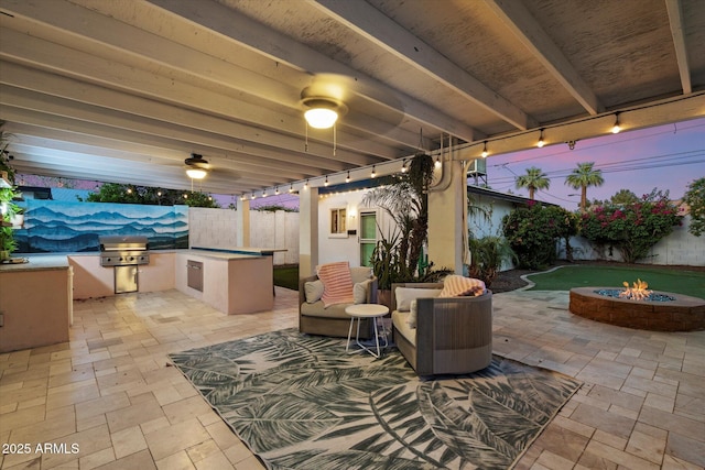 5707 N 12th Pl, Phoenix, AZ 85014 - fenced backyard with a fire pit, a patio, and ceiling fan
