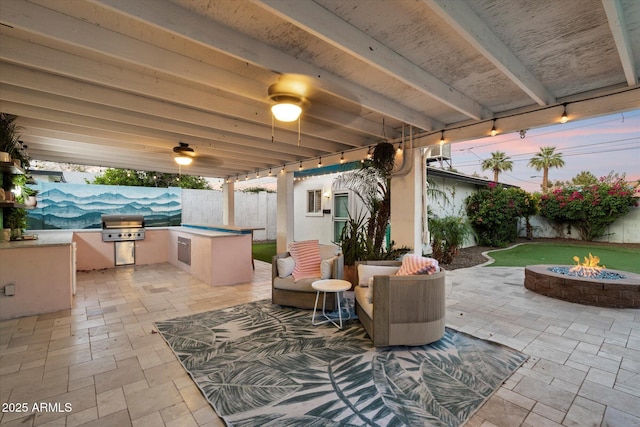 5707 N 12th Pl, Phoenix, AZ 85014 - fenced backyard with a fire pit and a patio area