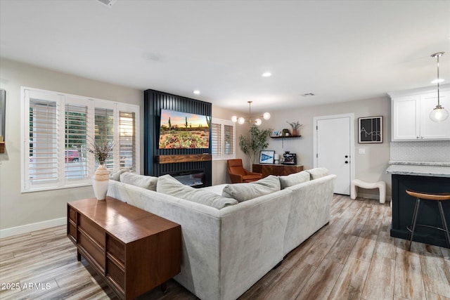 5707 N 12th Pl, Phoenix, AZ 85014 - living room featuring light wood-style flooring, baseboards, and recessed lighting