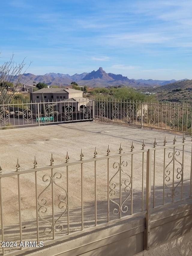 view of gate with a mountain view