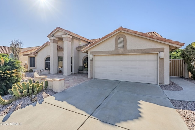 mediterranean / spanish-style house featuring a garage