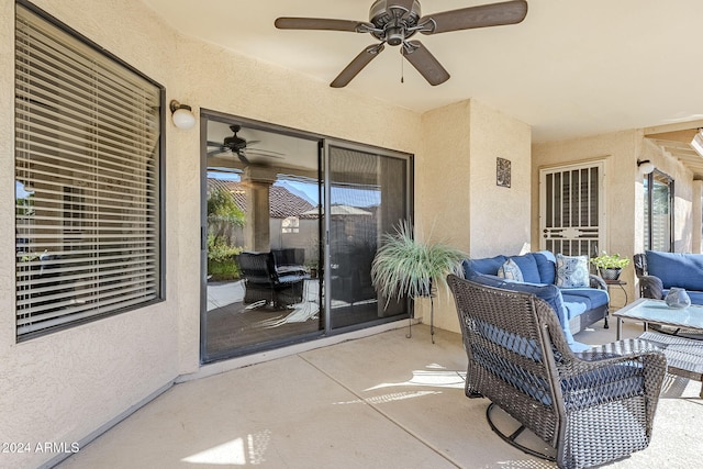 view of patio with an outdoor living space and ceiling fan