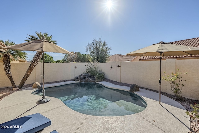 view of pool with pool water feature