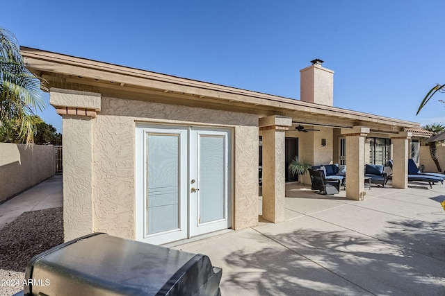 back of property featuring a patio area, ceiling fan, french doors, and an outdoor living space