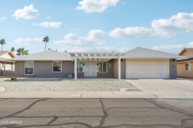 view of front facade with a pergola and a garage